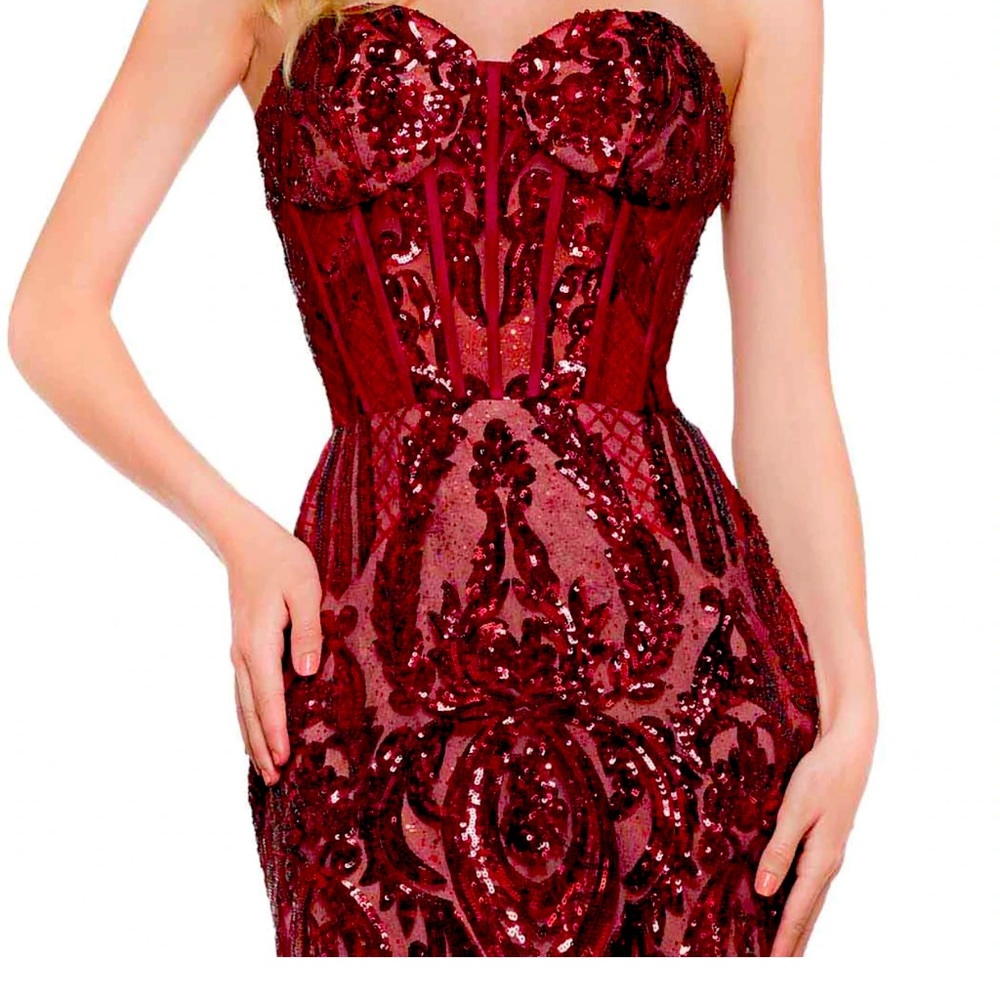 It’s a Burgundy color dress from color dress. Sequin and mesh dress, 48”.